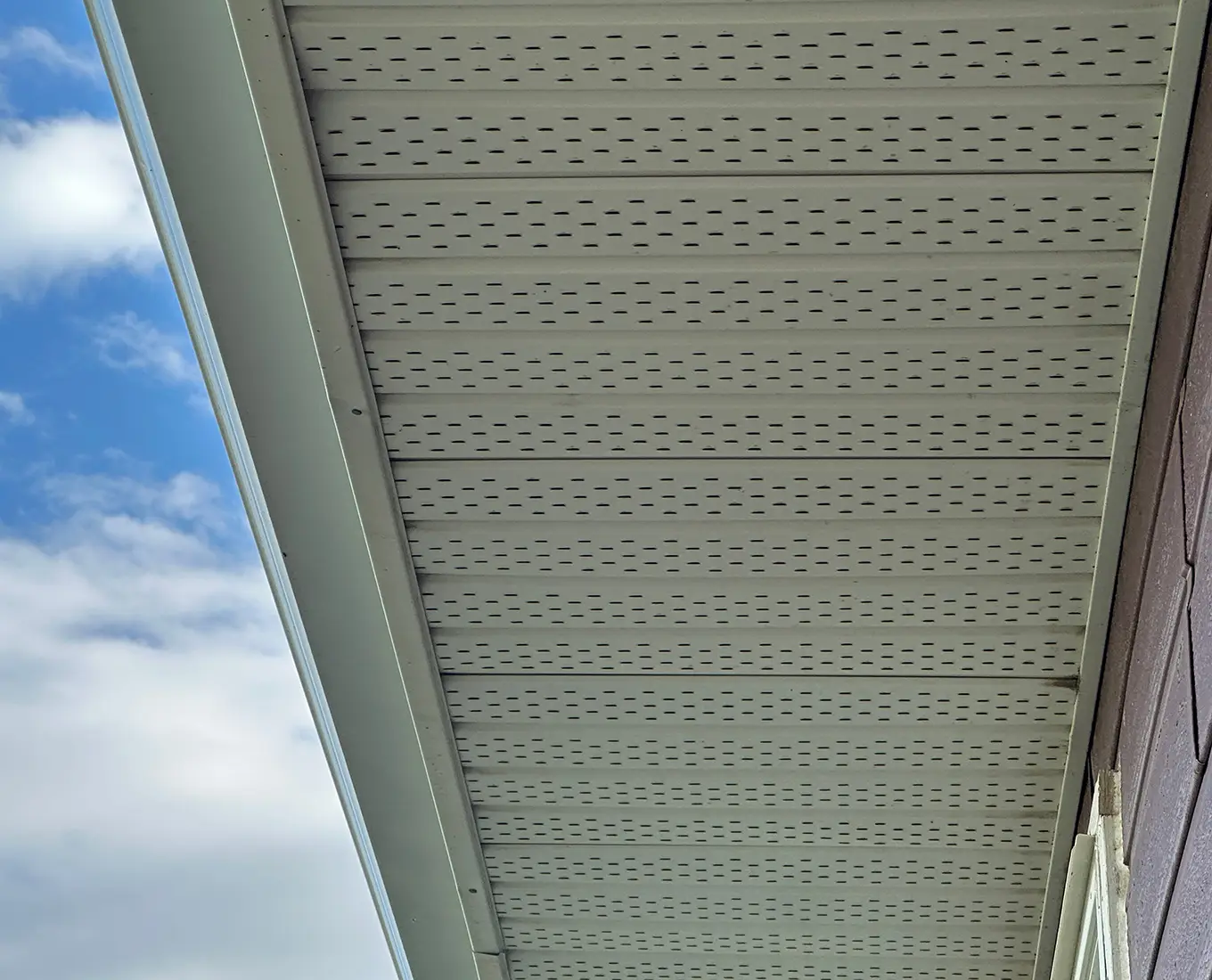 Roofing soffit detail showing ventilation and trim work in st louis mo
