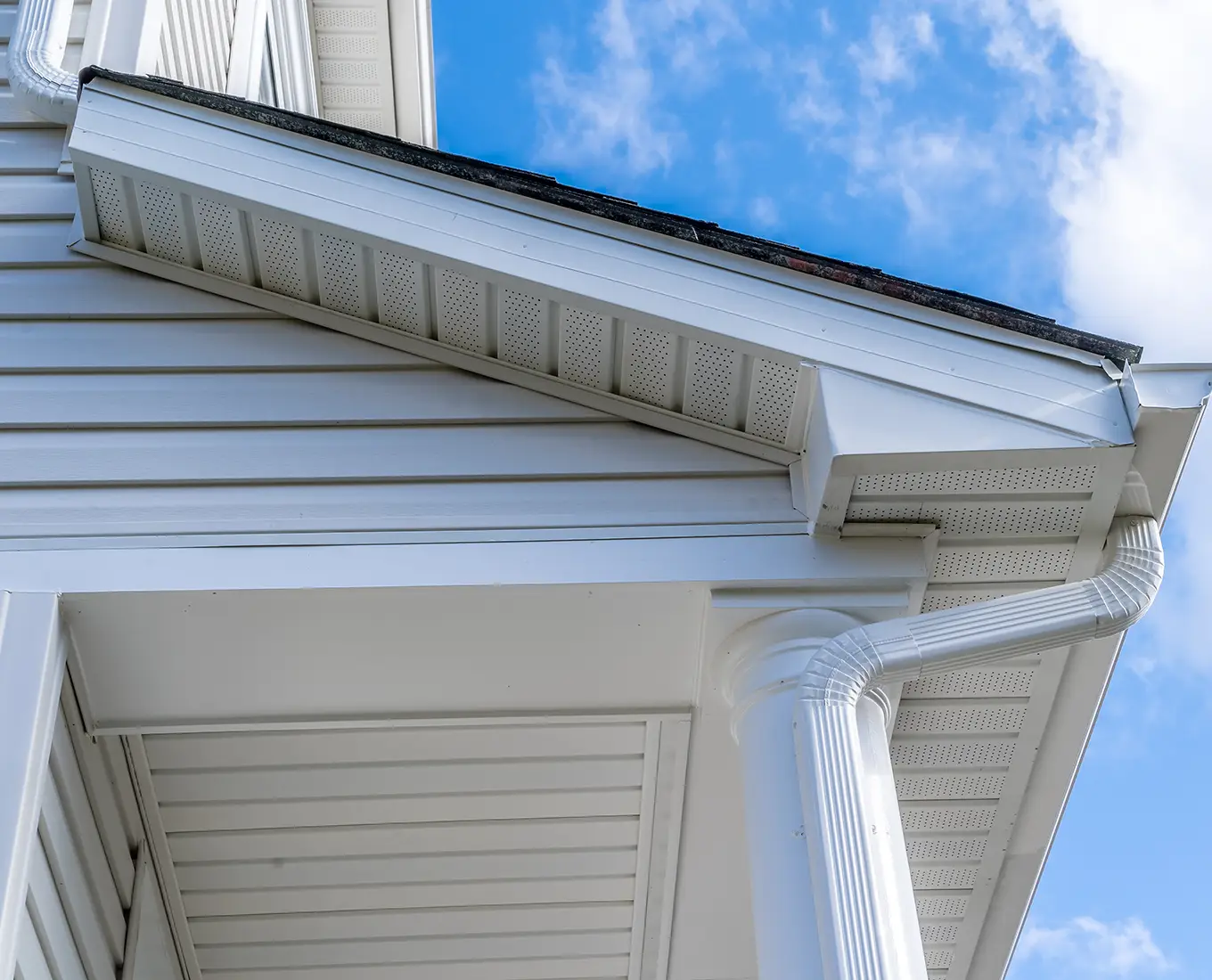 gutter drop connecting the outlet to the downspout with soffit, fascia in st louis mo