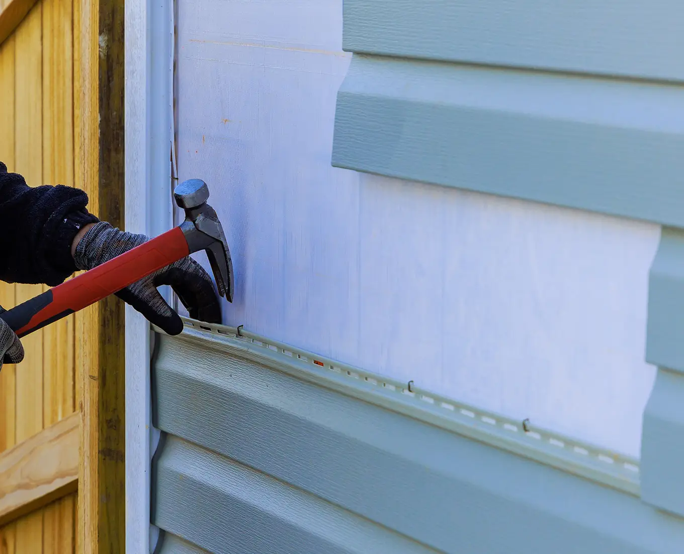 Replacing plastic siding on an exterior wall of residence house in st louis mo