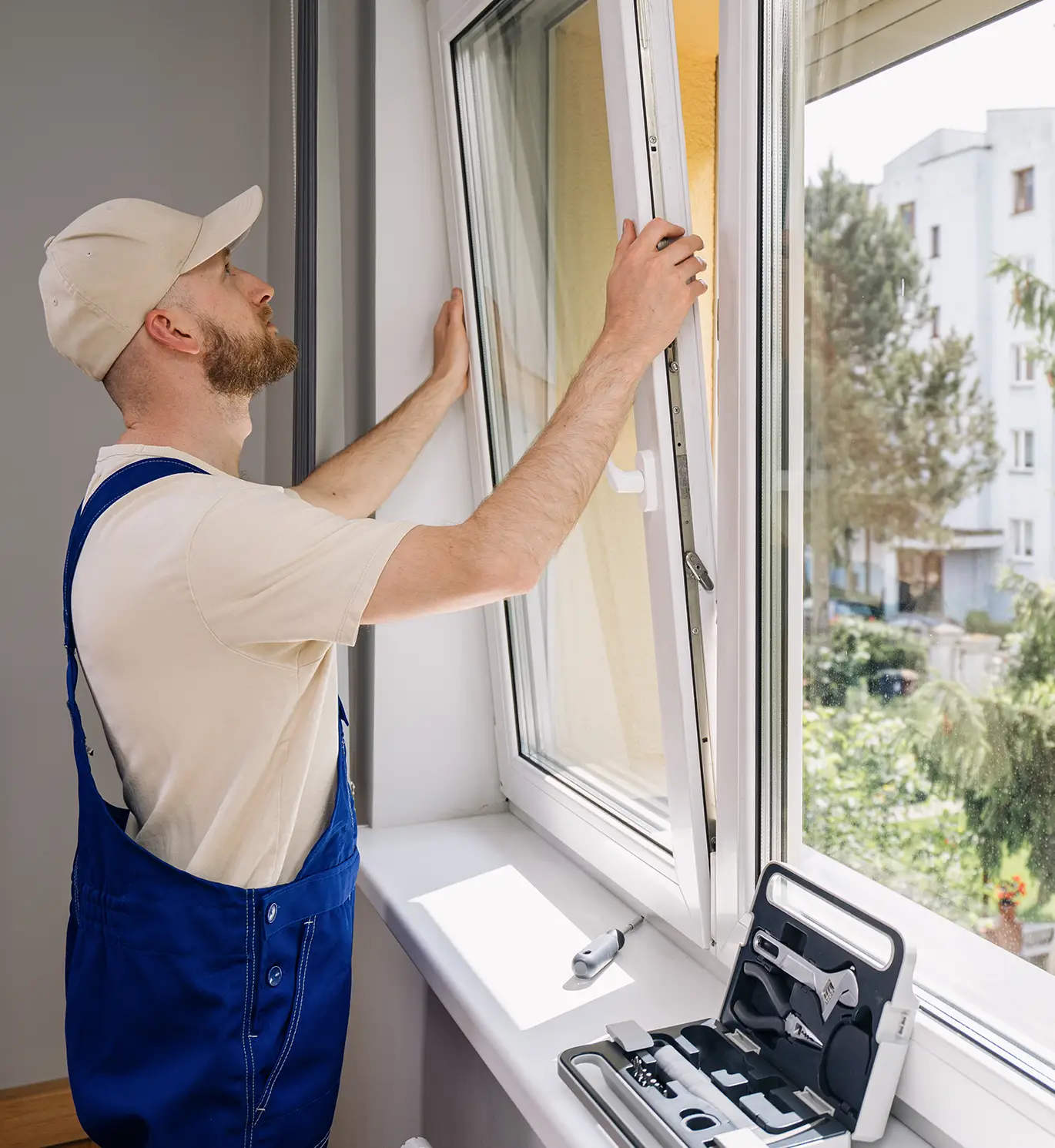 worker installing an energy-efficient window in a home in st louis mo