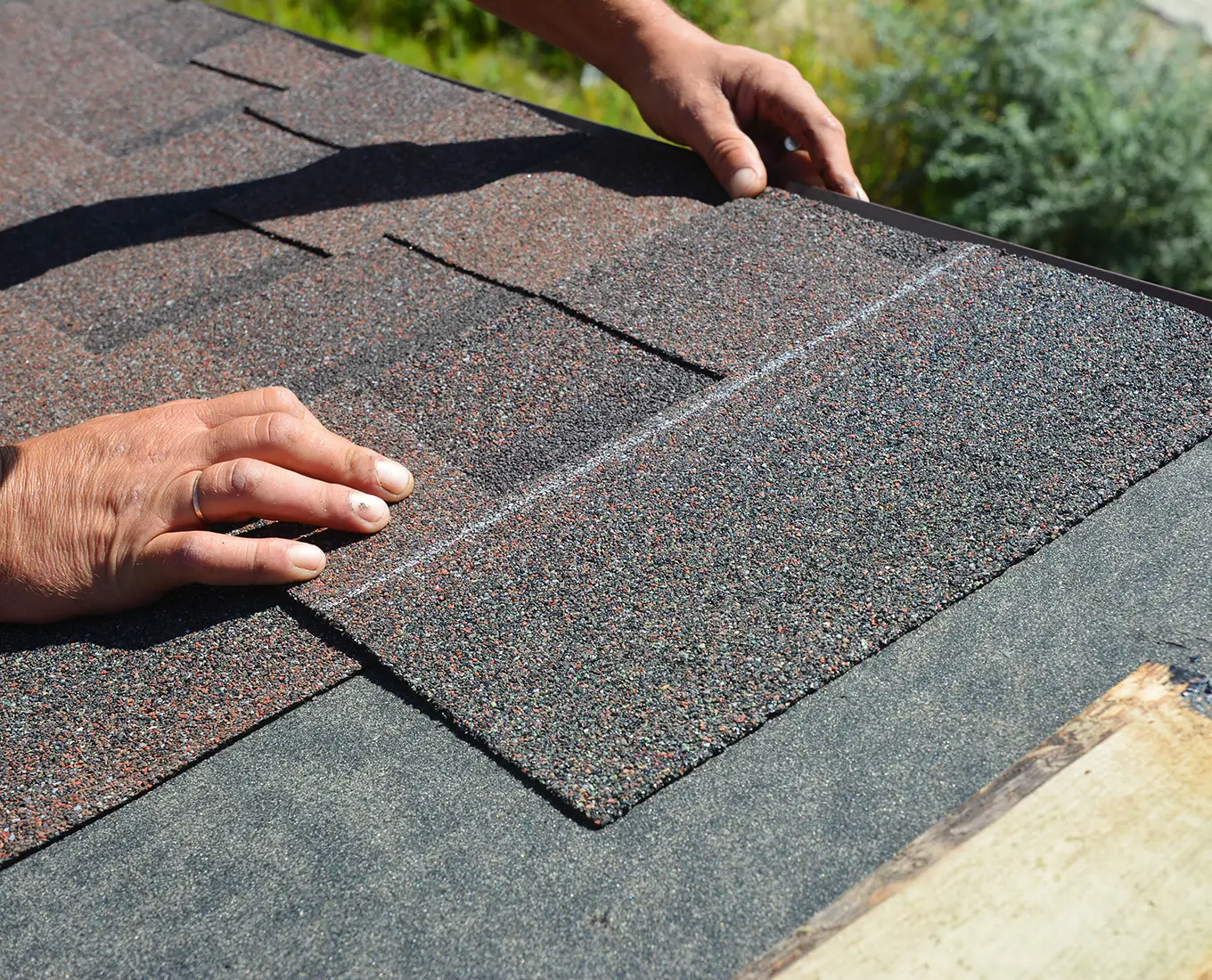 Roofer Contractor Installing Asphalt Shingles on House Roofing in st louis mo