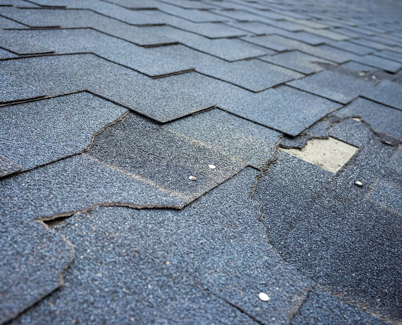 bitumen shingles roof damage that needs repair in st louis mo