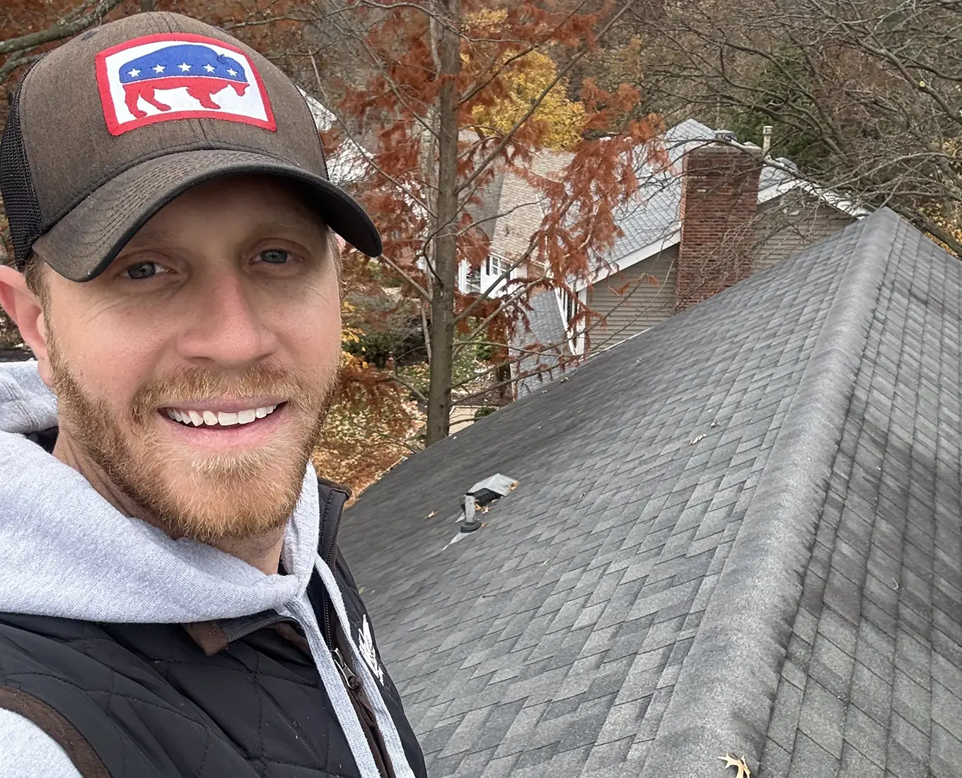 tanner on top of roof working on roof repair in st. louis mo