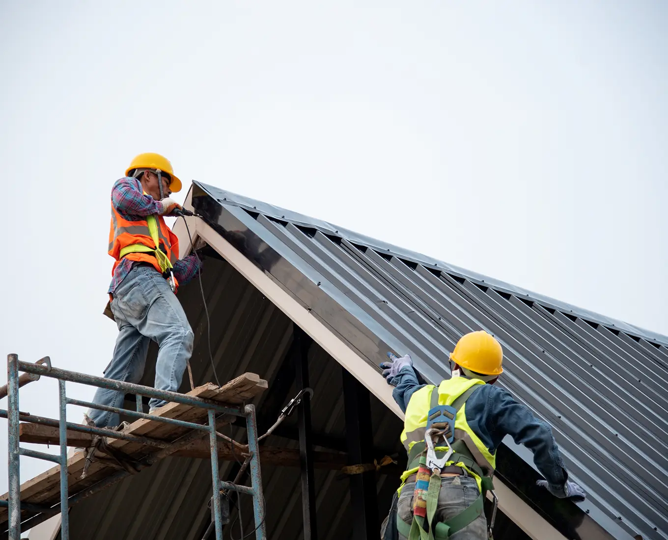 roofers installing new metal roof on house in st louis mo
