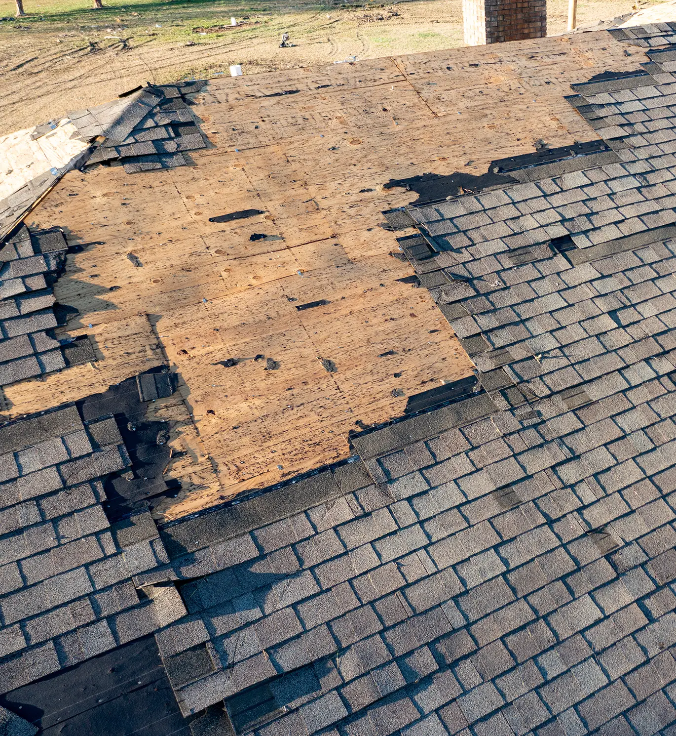 roof with storm damage that needs repair on house in st louis mo
